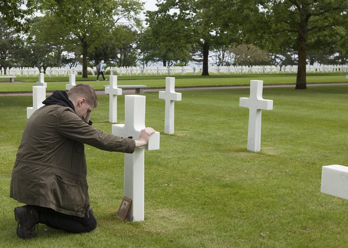 Normandy American Cemetery and Memorial Marine visits gravesite of WWII family hero photo